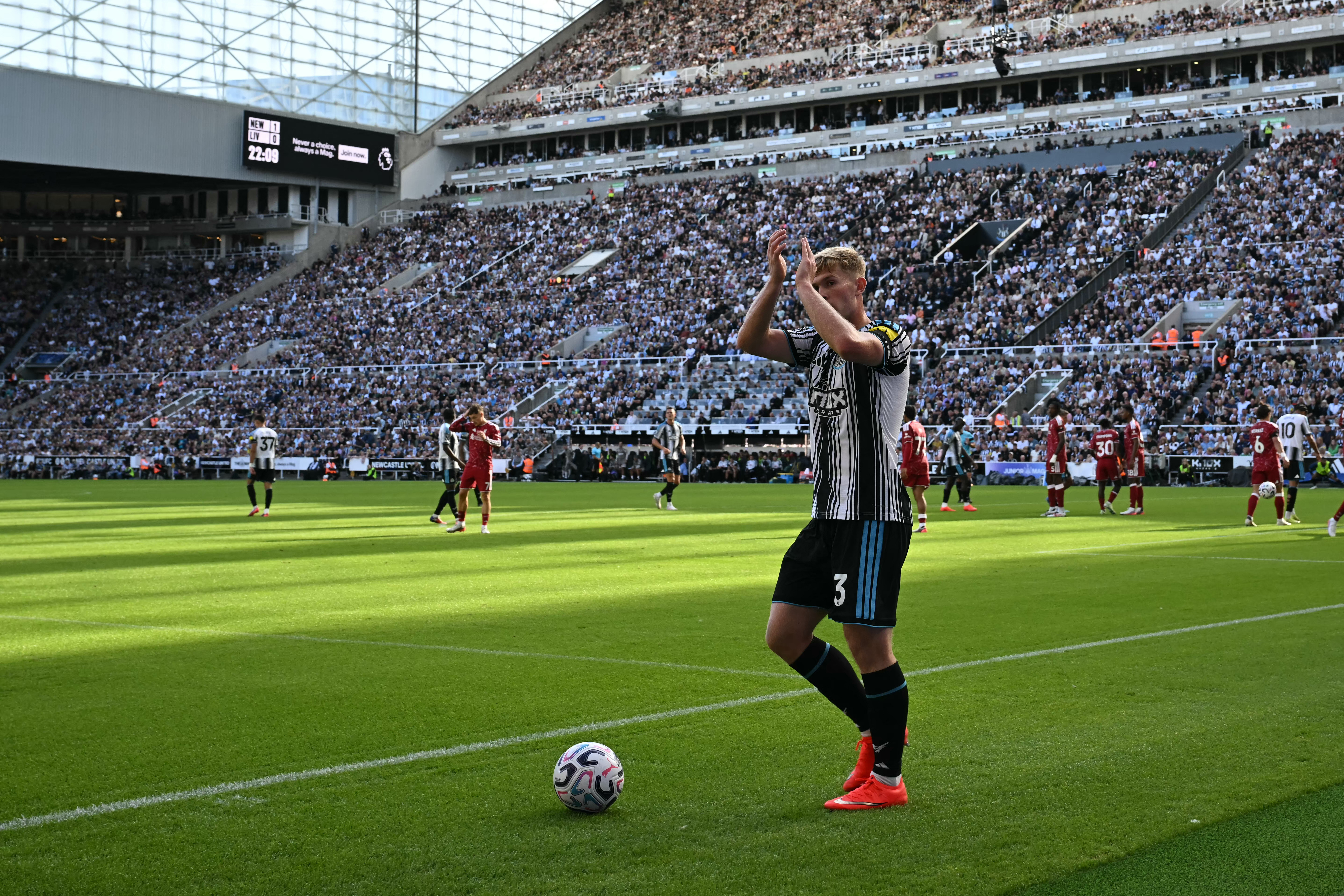 Newcastle United's English midfielder #03 Lewis Hall applauds as he goes to take a corner during the English Premier League football match between Newcastle United and Liverpool at St James' Park in Newcastle-upon-Tyne, north east England on August 23, 2026. (Photo by Paul ELLIS / AFP) / RESTRICTED TO EDITORIAL USE. No use with unauthorized audio, video, data, fixture lists, club/league logos or 'live' services. Online in-match use limited to 120 images. An additional 40 images may be used in extra time. No video emulation. Social media in-match use limited to 120 images. An additional 40 images may be used in extra time. No use in betting publications, games or single club/league/player publications. /