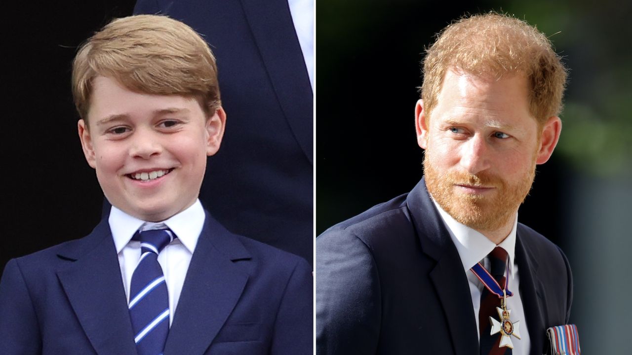 Prince George laughs while wearing a navy suit with a navy, red, and white striped tie, and Prince Harry wears a navy suit with his military medals attached