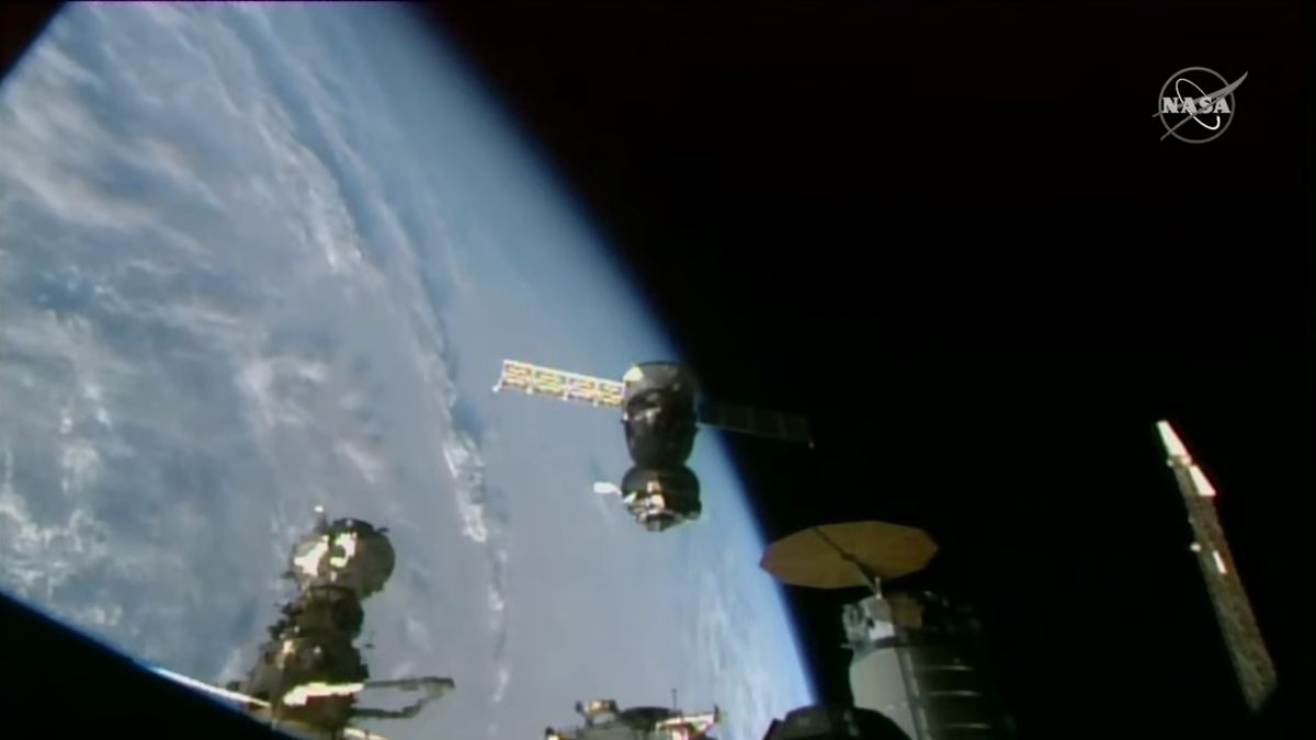 A Russian Soyuz MS-22 spacecraft is seen after undocking from the International Space Station with a bright blue Earth in the background on March 28, 2023. The Soyuz suffered a coolant leak in December 2022 and returned to Earth without a crew.
