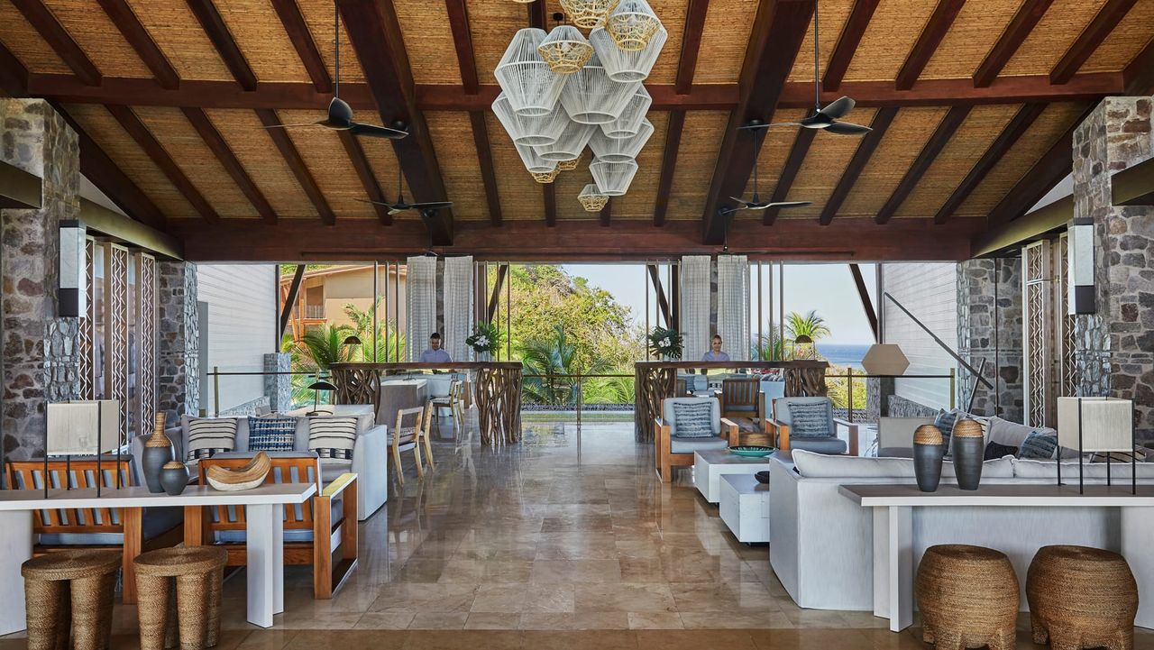 Image of an indoor-outdoor communal area at a resort.
