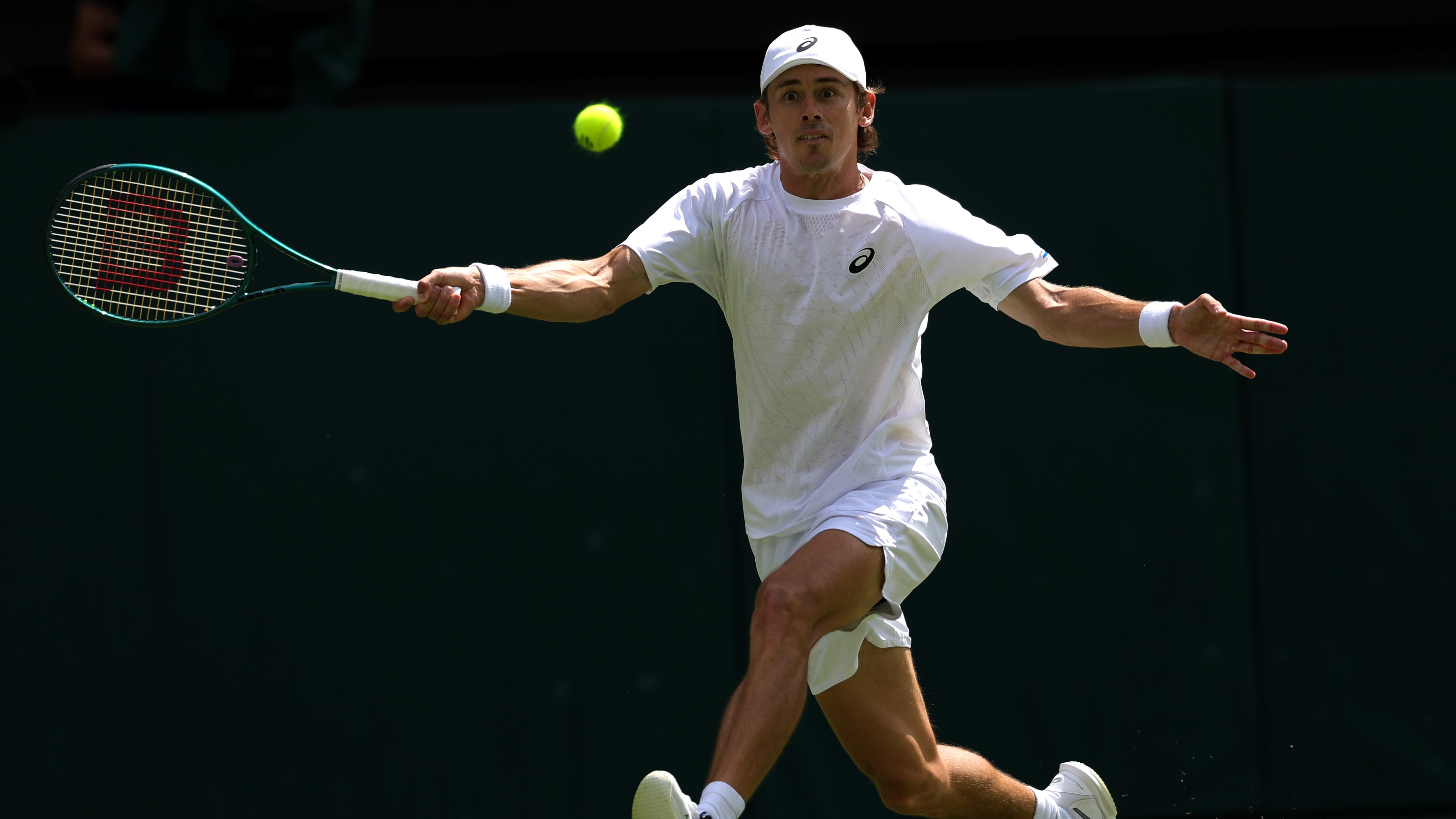 Alex de Minaur playing against Novak Djokovic at Wimbledon 2025