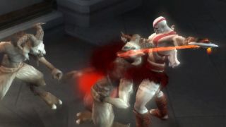 Kratos slices the throat of a goat enemy in the PSP game God of War: Chains of Olympus