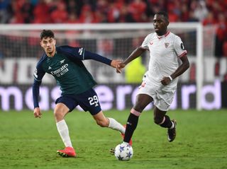 Kai Havertz of Arsenal closes down Boubakary Soumare of Sevilla during the Premier League match between Chelsea FC and Arsenal FC at Stamford Bridge on October 21, 2023 in London, England.
