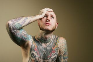 guy regretting tattoos.