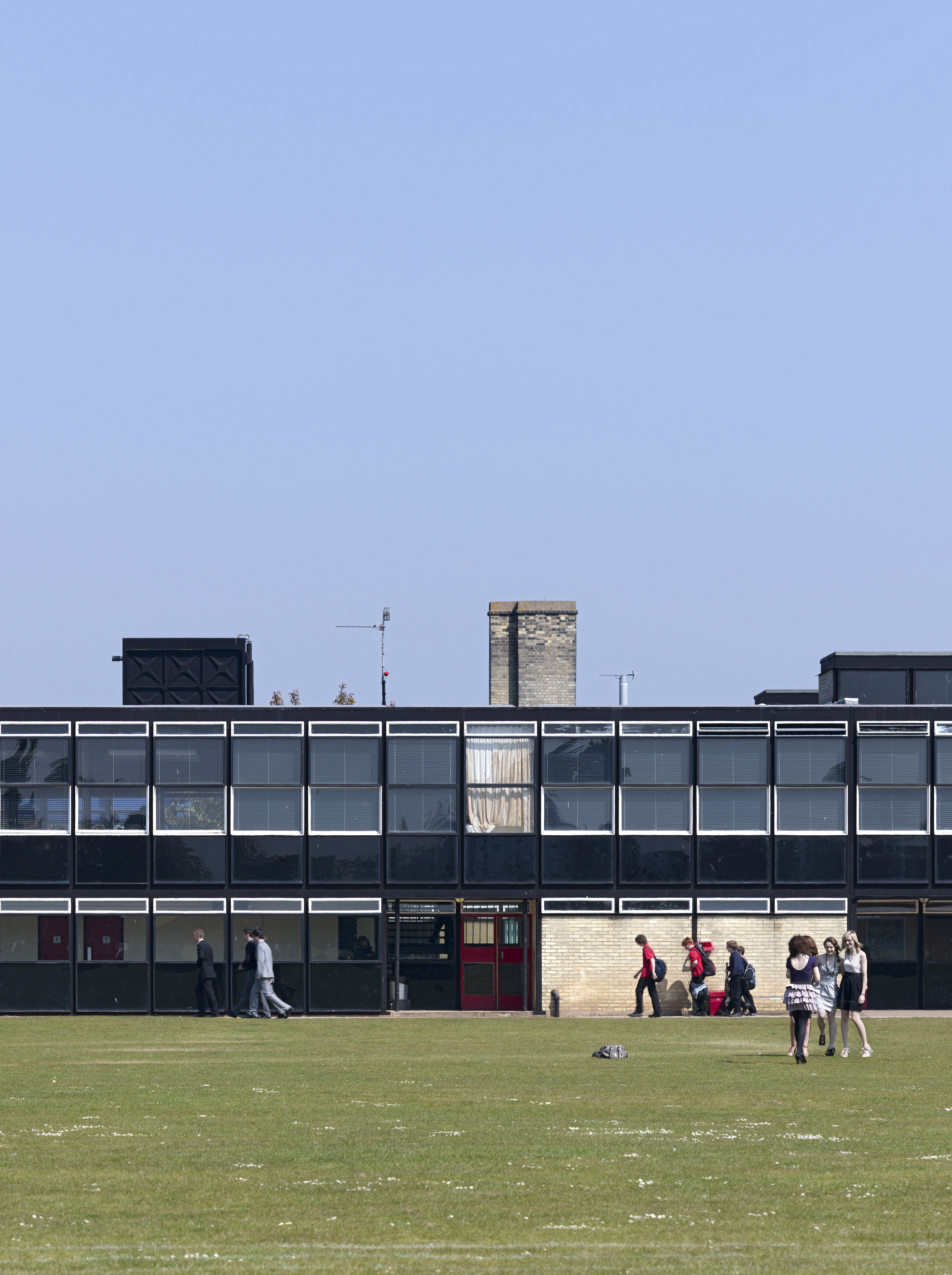 views of brutalist school on blue sky day - Hunstanton school aka Smithdon High School by alison and peter smithson