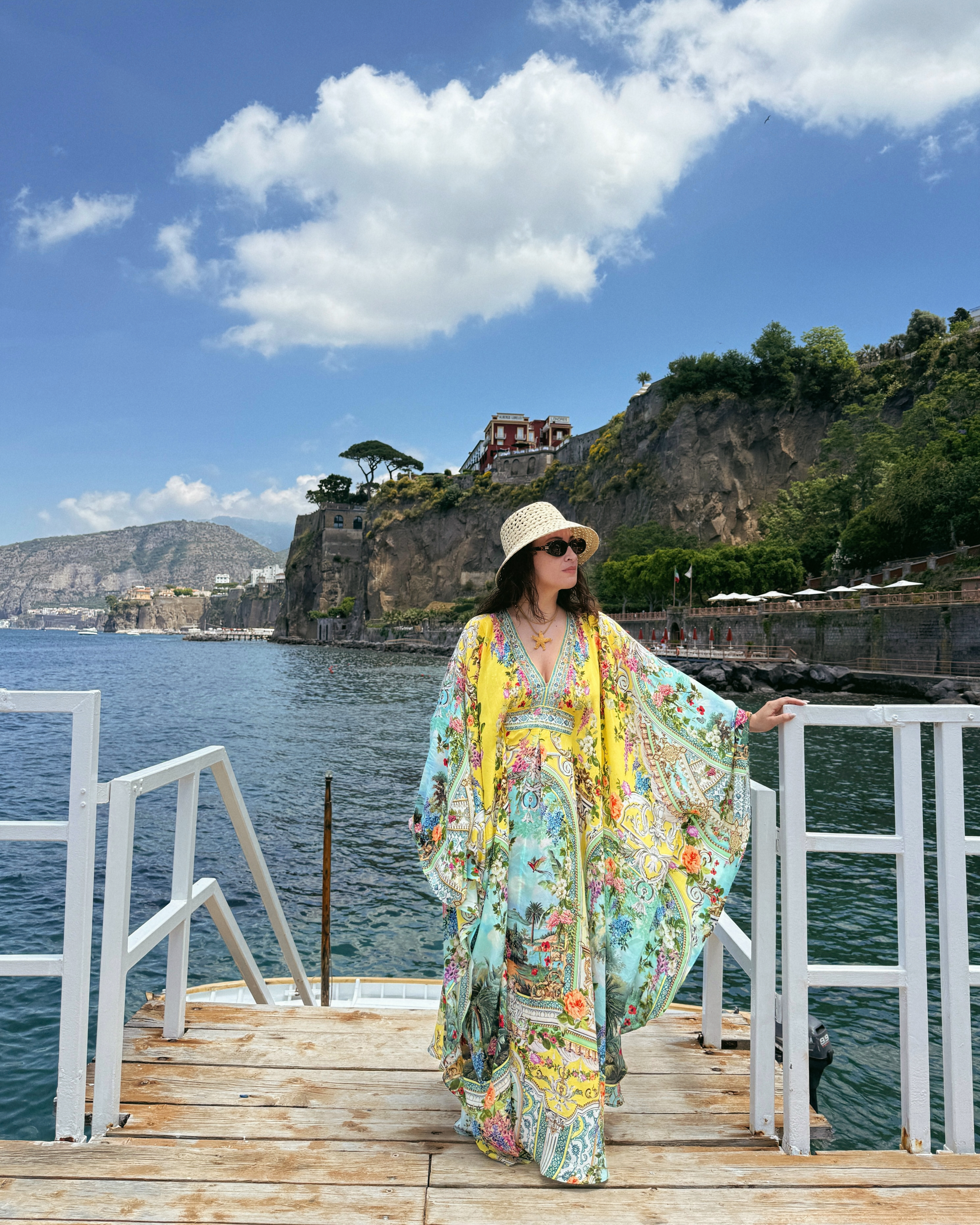 Bella Gerard shows off a printed caftan by CAMILLA