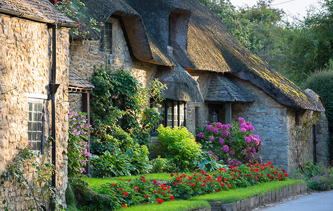 Quaint attractive traditional thatched country cottage at Broad Campden in the Cotswolds, Gloucestershire