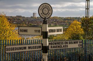 The direction sign post at the Eastern end of the Hadrian's wall path at Segedunum Museum, Wallsend, Newcastle.