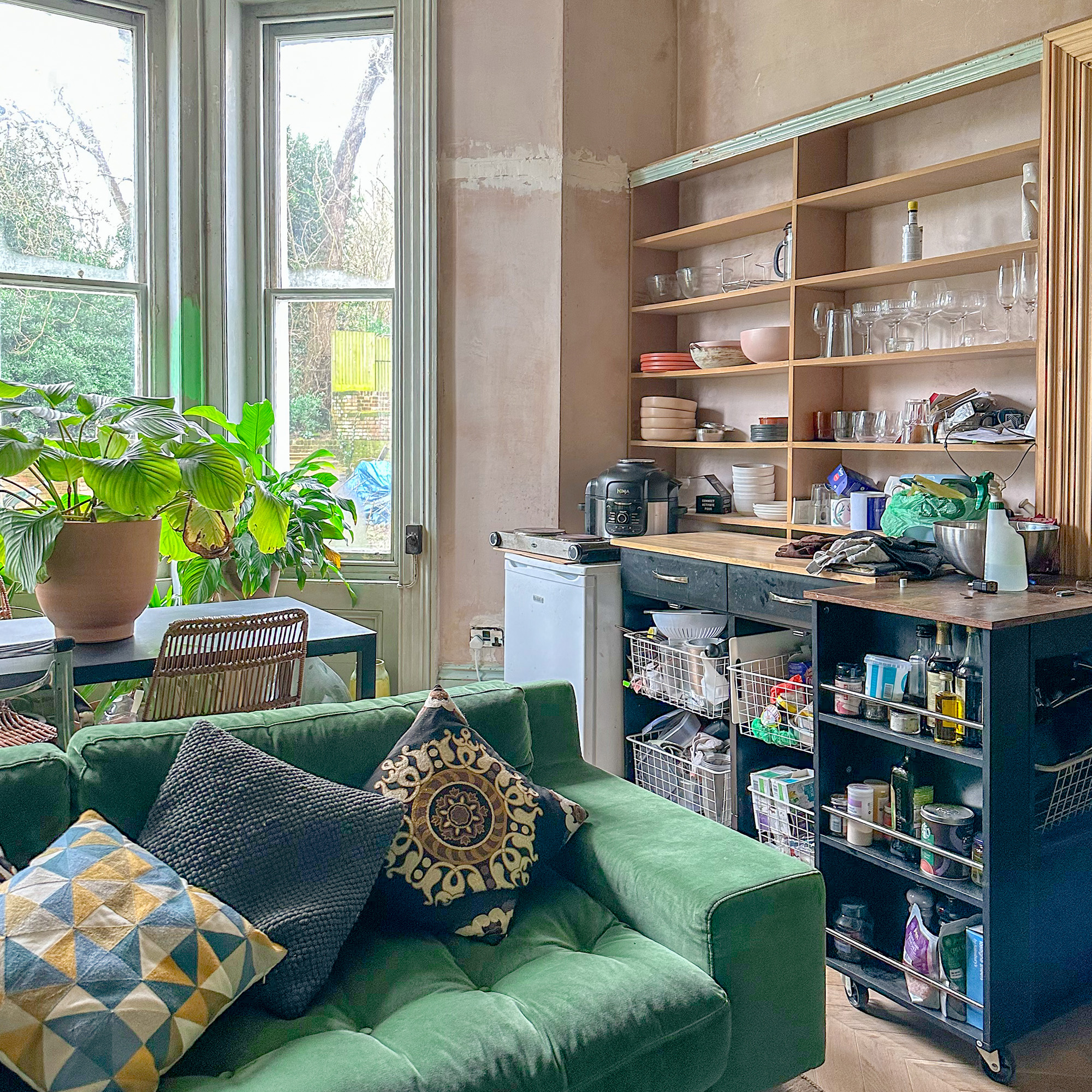 living room mid renovation. with a temporary kitchen in it