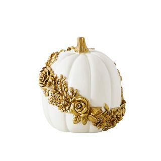 A white pumpkin with gold embellished work