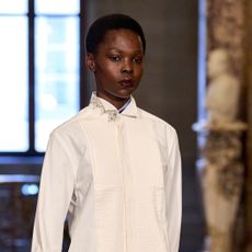 Model wearing a deep purple lip stain.