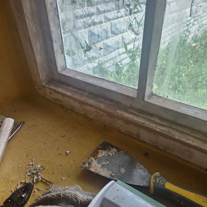 wooden windows with paint stripped and scraped off