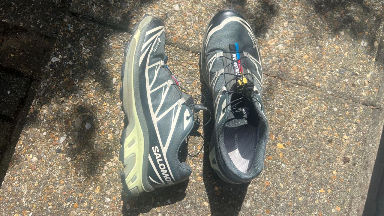 Grace Walsh's Salomon XT-6 walking shoes sitting on concrete in the sunshine