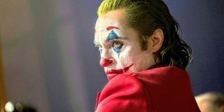 Joaquin Phoenix as Joker in full clown makeup