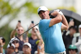 Brooks Koepka hits a fairway wood shot at LIV Golf Singapore