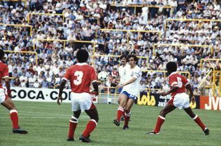 Michel Platini (centre) in action against Kuwait at the 1982 World Cup.