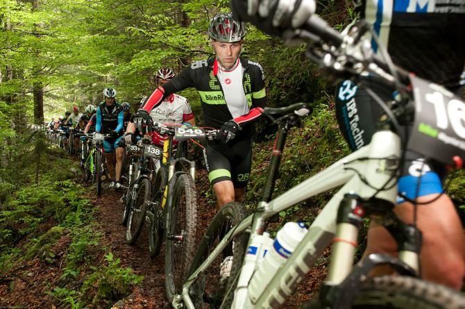Racers hike-a-bike during stage 1 of the Bike Four Peaks