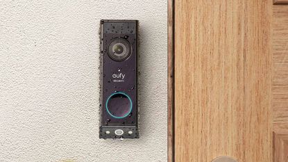 eufy E340 video doorbell on rendered masonry