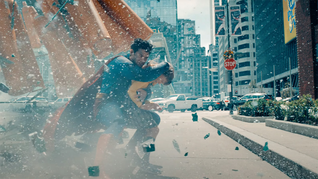 Superman saving a young child on Ross Avenue in 2025's Superman movie