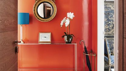 orange entryway with console table