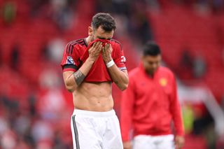 Bruno Fernandes of Manchester United looks dejected following the team's defeat in the Premier League match between Manchester United and Brighton & Hove Albion at Old Trafford on September 16, 2023 in Manchester, England.