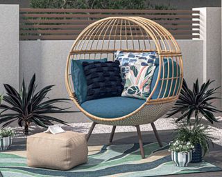 outdoor furniture at Lowe's egg chair with teal cushion