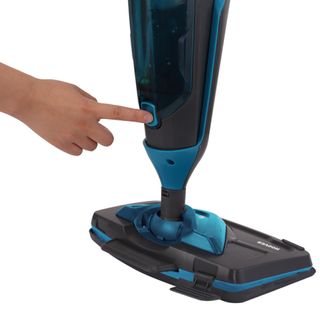 Closeup of a finger pressing a button on the Hoover Steam Capsule 2 in 1 steam cleaner
