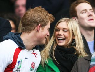 Prince Harry and Chelsy Davy smile at one another