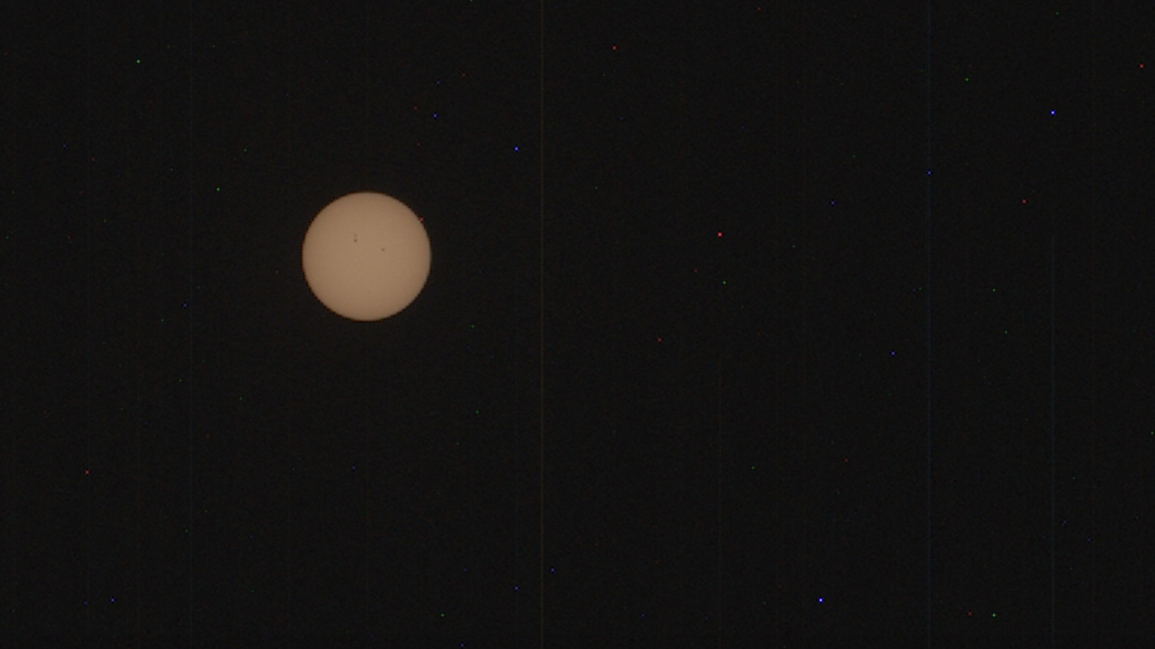 Image of the yellow solar disk against a black sky, captured from afar.