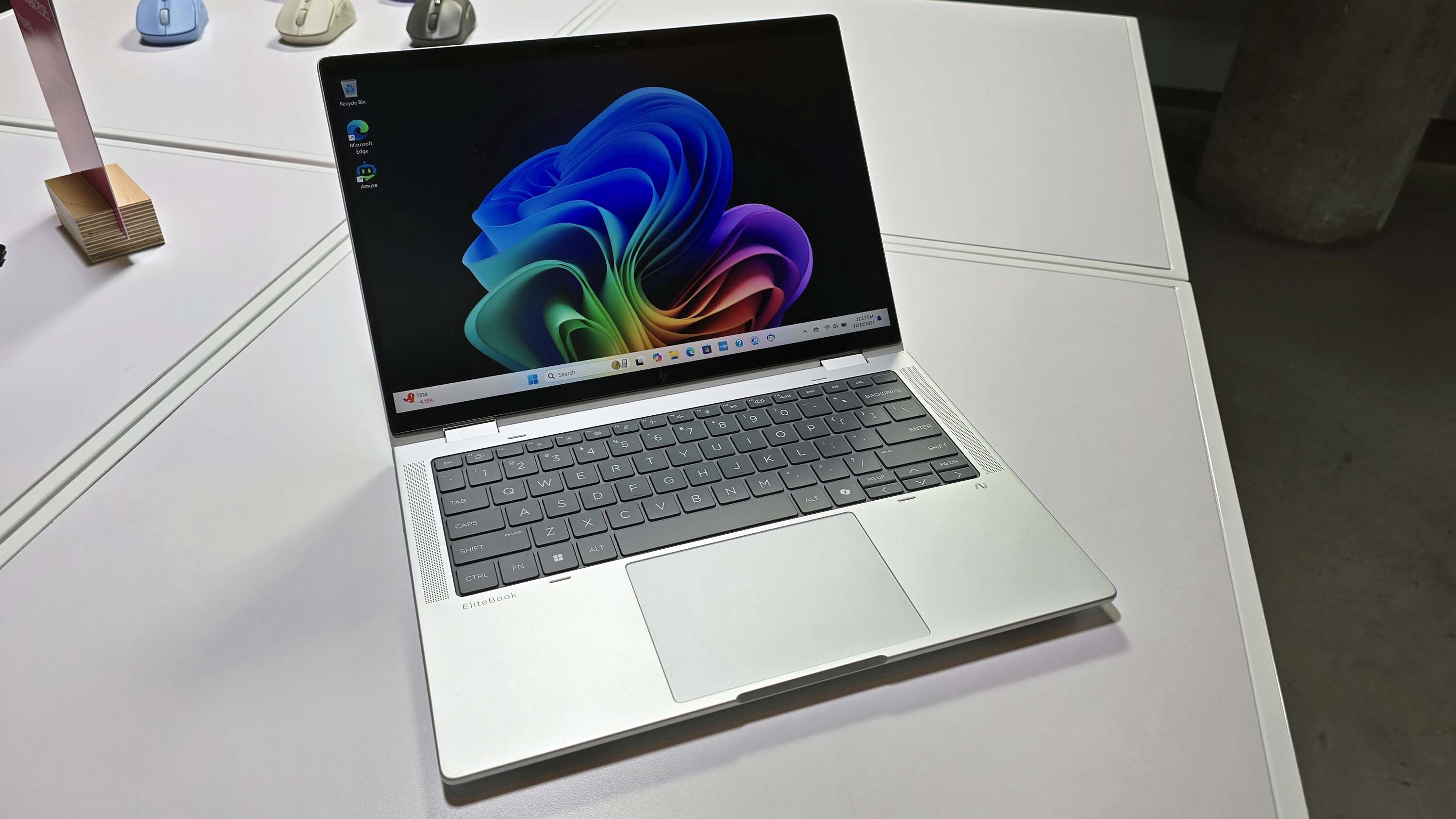 The HP EliteBook X Flip 14 (G1i) on a desk.