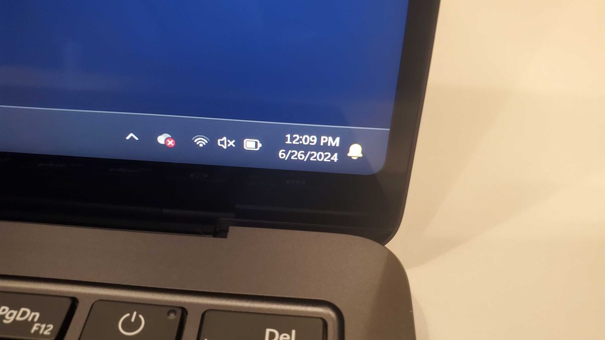 black laptop on white table