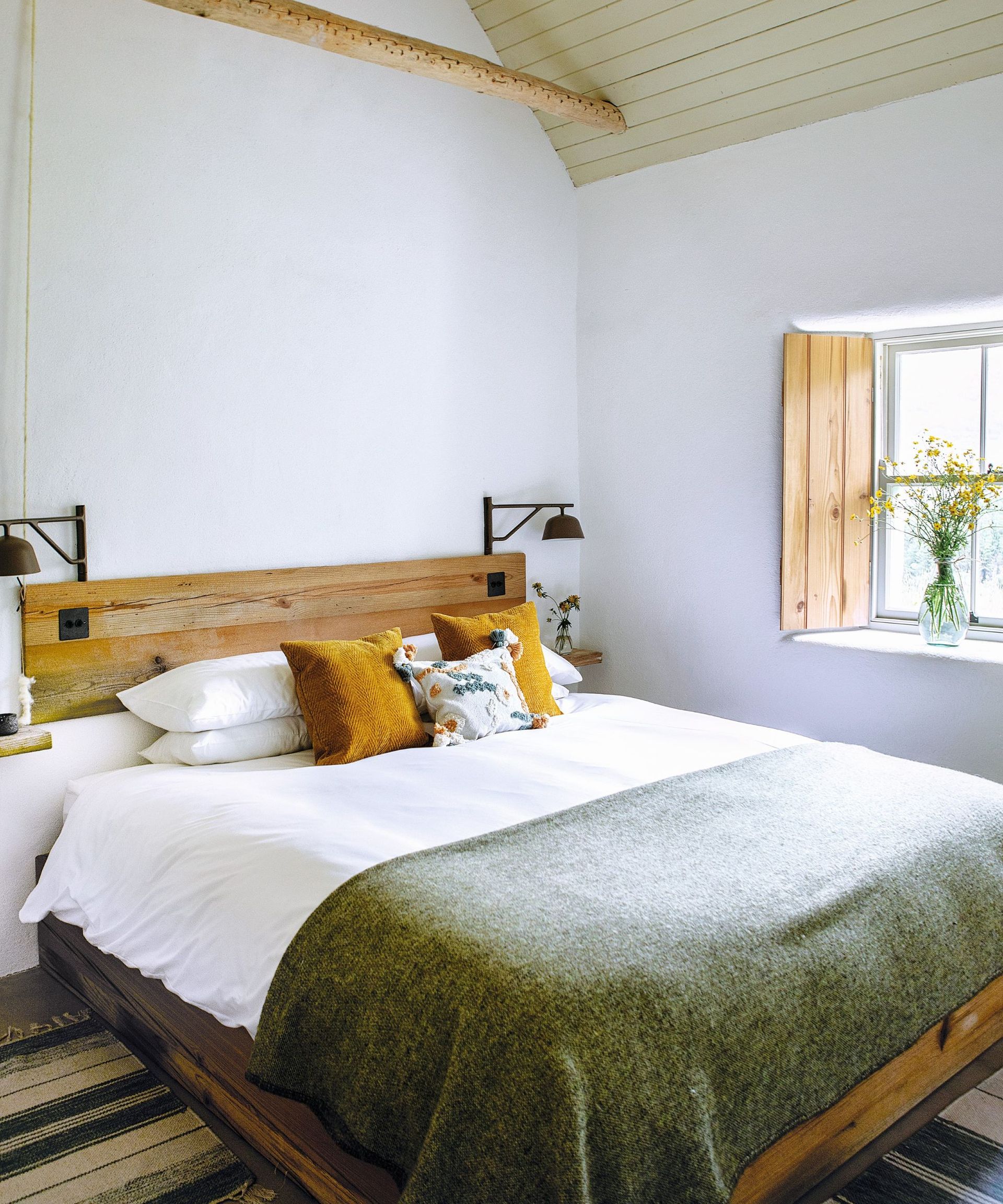 Wooden beam and shutters, yellow cushions