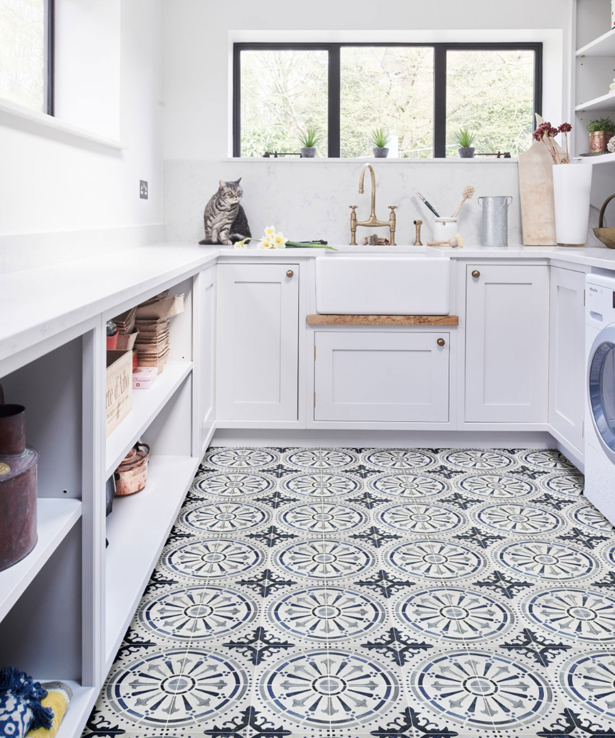 white utility room with Shaker units and patterned tiled floor