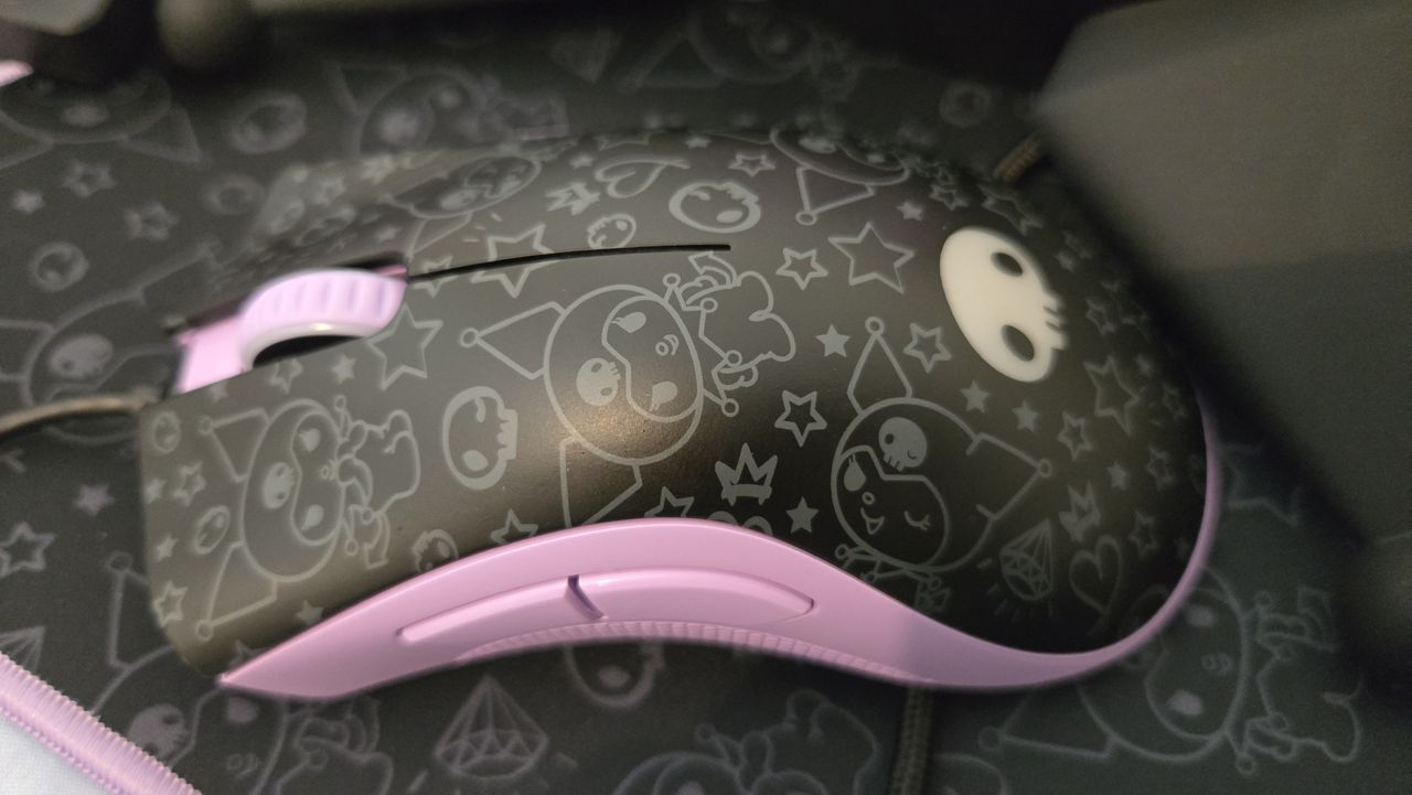 Razer | Kuromi collection peripherals laid out on a desk.