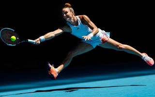 Greek tennis player Maria Sakkari leaping for a forehand shot at the Australian Open