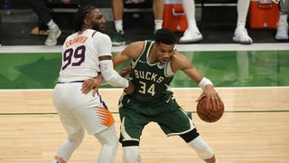 Giannis Antetokounmpo #34 of the Milwaukee Bucks drives to the basket against Jae Crowder #99 of the Phoenix Suns during the second half in Game Three of the NBA Finals at Fiserv Forum on July 11, 2021 in Milwaukee, Wisconsin.