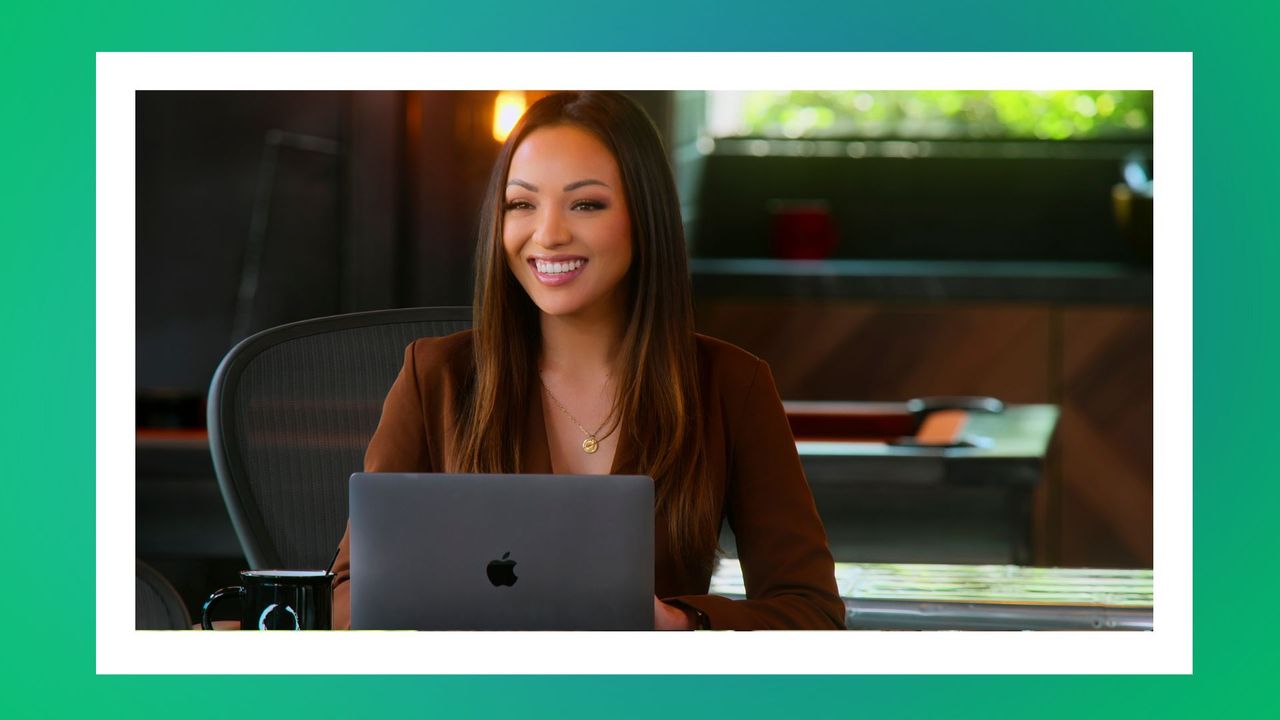 lauren shortt at her desk in the oppenheim group office