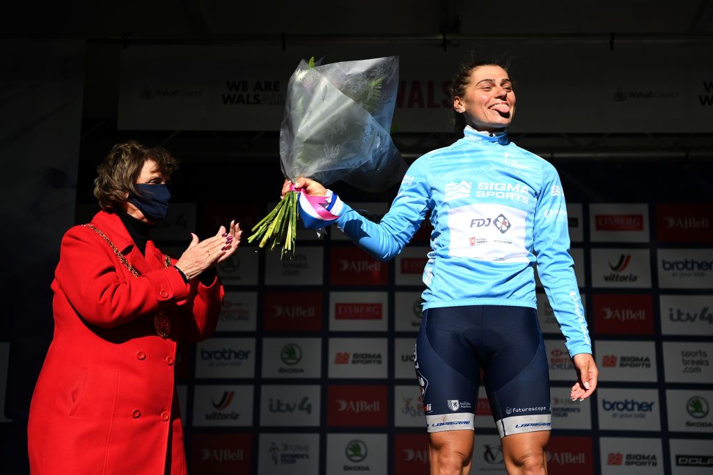 WALSALL ENGLAND OCTOBER 05 Clara Copponi of France and Team FDJ Nouvelle Aquitaine Futuroscope celebrates winning the Turquoise points jersey on the podium ceremony after the 7th The Womens Tour 2021 Stage 2 a 1022km stage from Walsall to Walsall thewomenstour UCIWWT on October 05 2021 in Walsall England Photo by Justin SetterfieldGetty Images