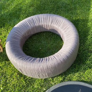 garden with tyre and grey string