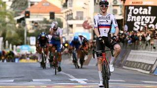 Matej Mohoric points to his bike in celebration at Milan-San Remo success