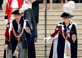 a medium shot of King Charles III and Queen Camilla at the Order of the Garter service at Windsor in June 2022