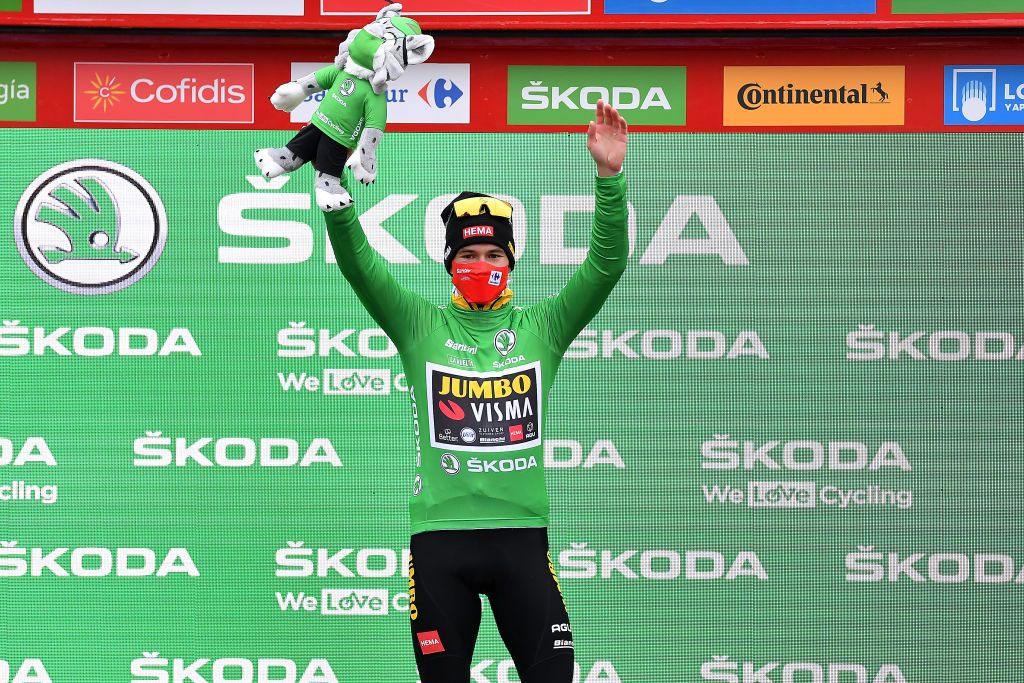 PUEBLA DE SANABRIA SPAIN NOVEMBER 05 Podium Primoz Roglic of Slovenia and Team Jumbo Visma Green Points Jersey Celebration Mascot Mask Covid Safety Measures during the 75th Tour of Spain 2020 Stage 15 a 2308km stage from Mos to Puebla de Sanabria 924m lavuelta LaVuelta20 La Vuelta on November 05 2020 in Puebla de Sanabria Spain Photo by Justin SetterfieldGetty Images