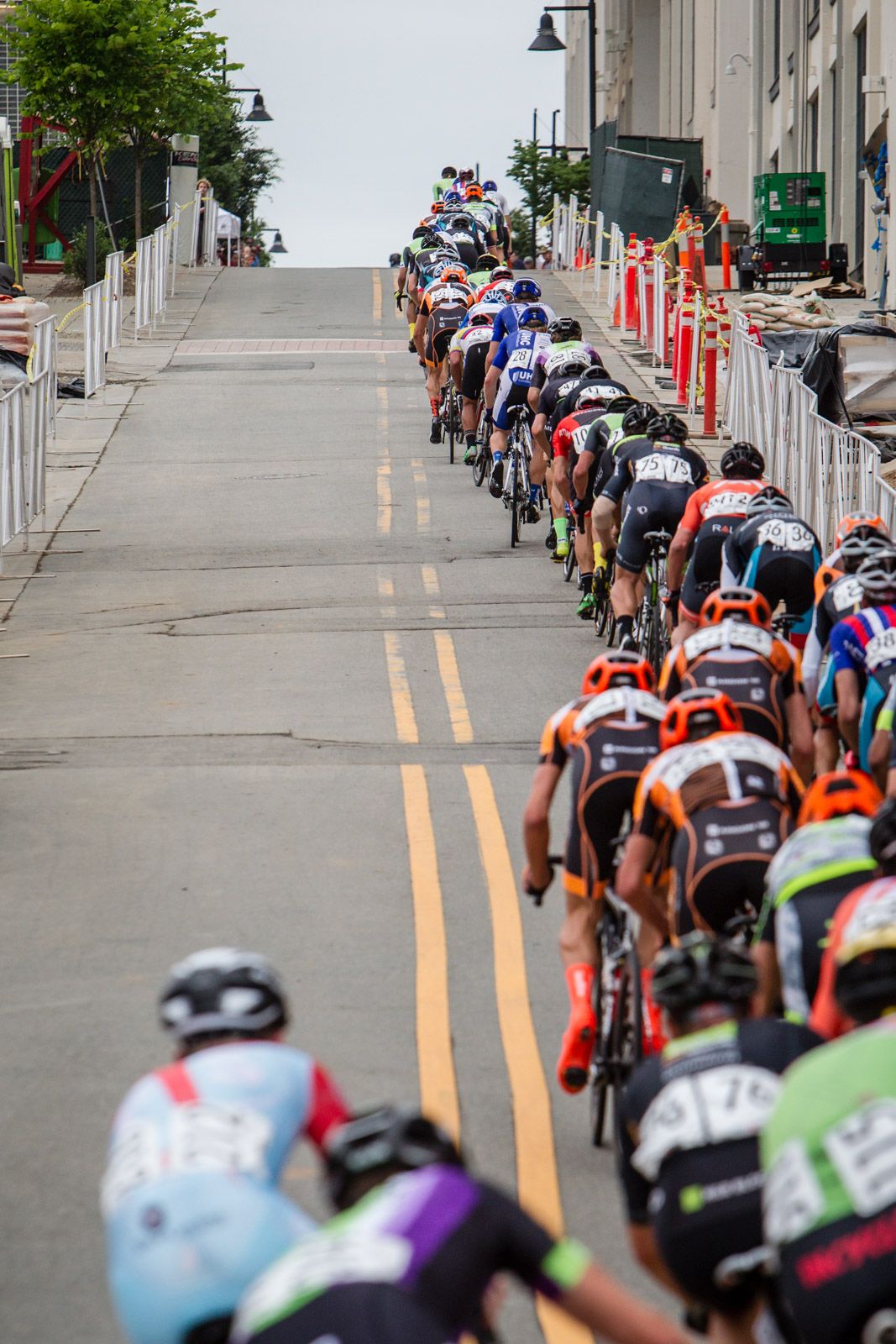 The peloton gets strung out over todays climb.