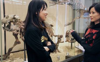 Kumiko Matsui (right) and Yuri Kimura (left) stand next to a Paleoparadoxia skeleton on display at the National Museum of Nature and Science, in Tokyo.