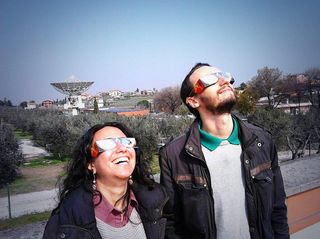 Space fans watch the solar eclipse of March 20, 2015 from the European Space Agency's ESRIN Earth Observation Center in Frascati, Italy near Rome.