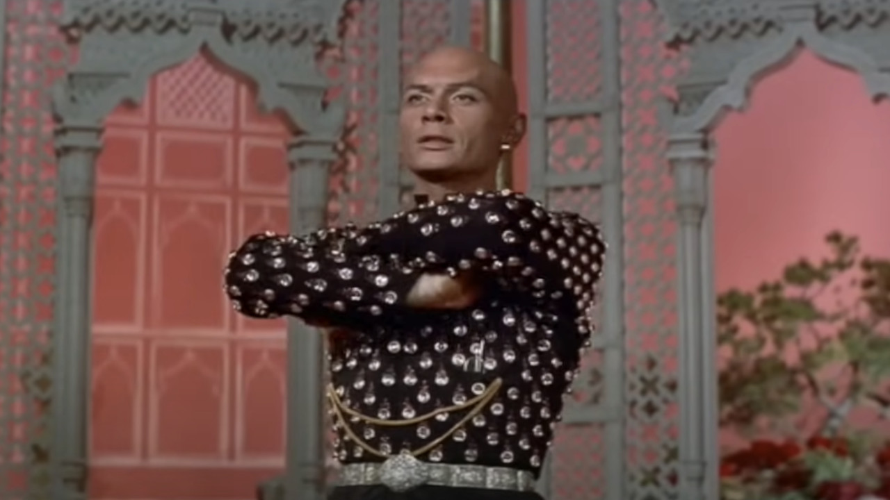 King Mongkut of Siam (Yul Brynner) looks on in The King and I