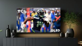 TCL Q7 QLED TV on stand in living room