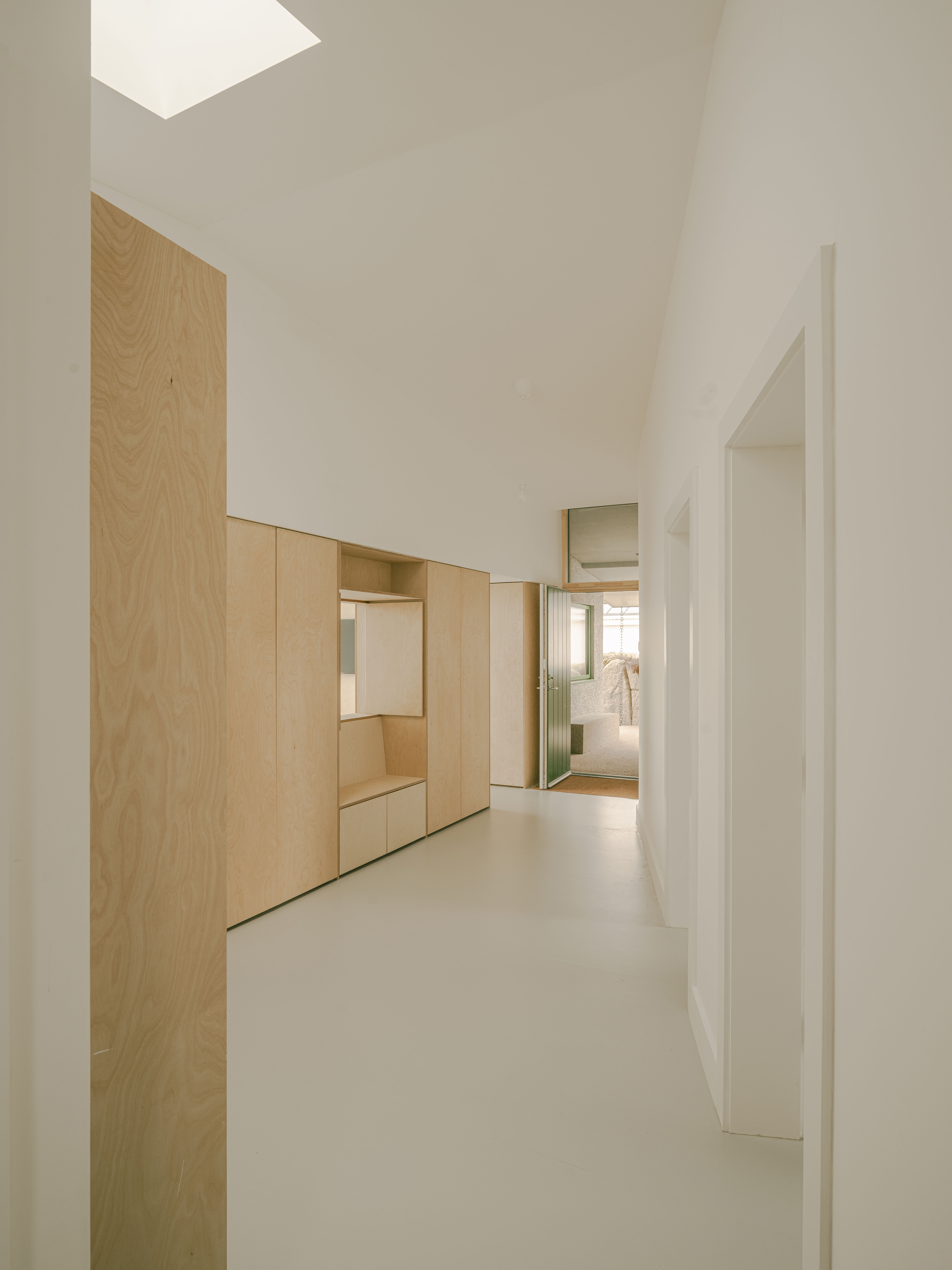 Looking back at the entrance, with a run of bedrooms on the right