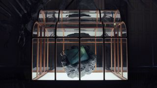 The T-Rex leather handbag on display in a musuem 