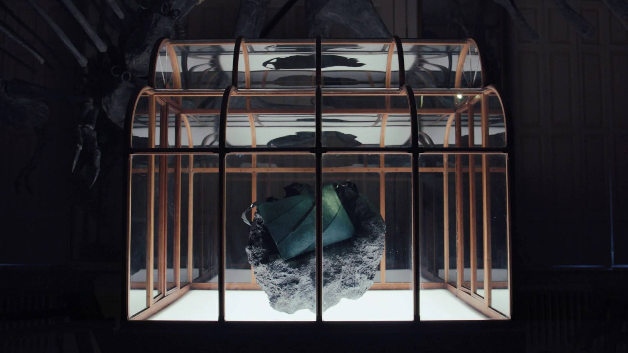 The T-Rex leather handbag on display in a musuem 